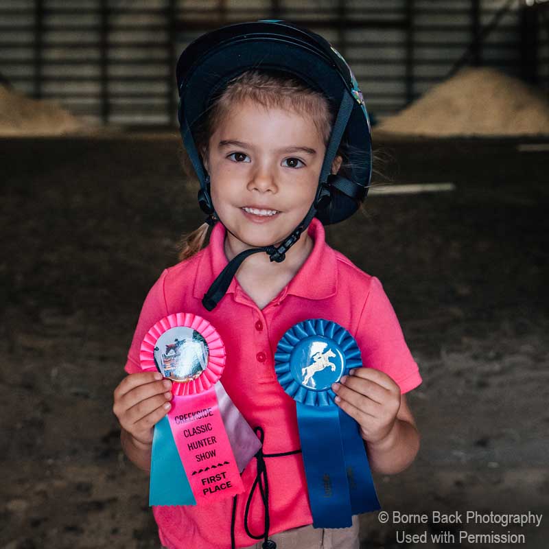 Creekside Equicenter young rider all smiles and ribbons at horse show in Walkerton, Indiana